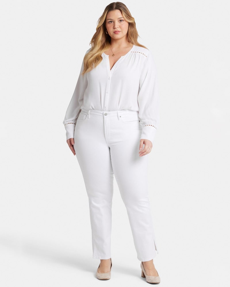 Front of a model wearing a size 18W Barbara Bootcut Side Slits in Optic White by NYDJ. | dia_product_style_image_id:348308